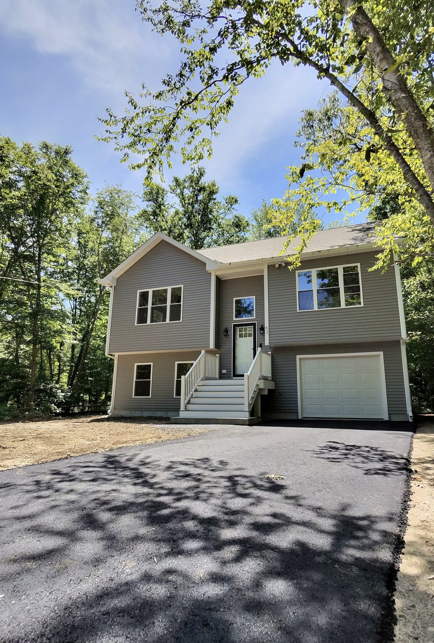 Front elevation of completed new construction split-level, Dartmouth MA